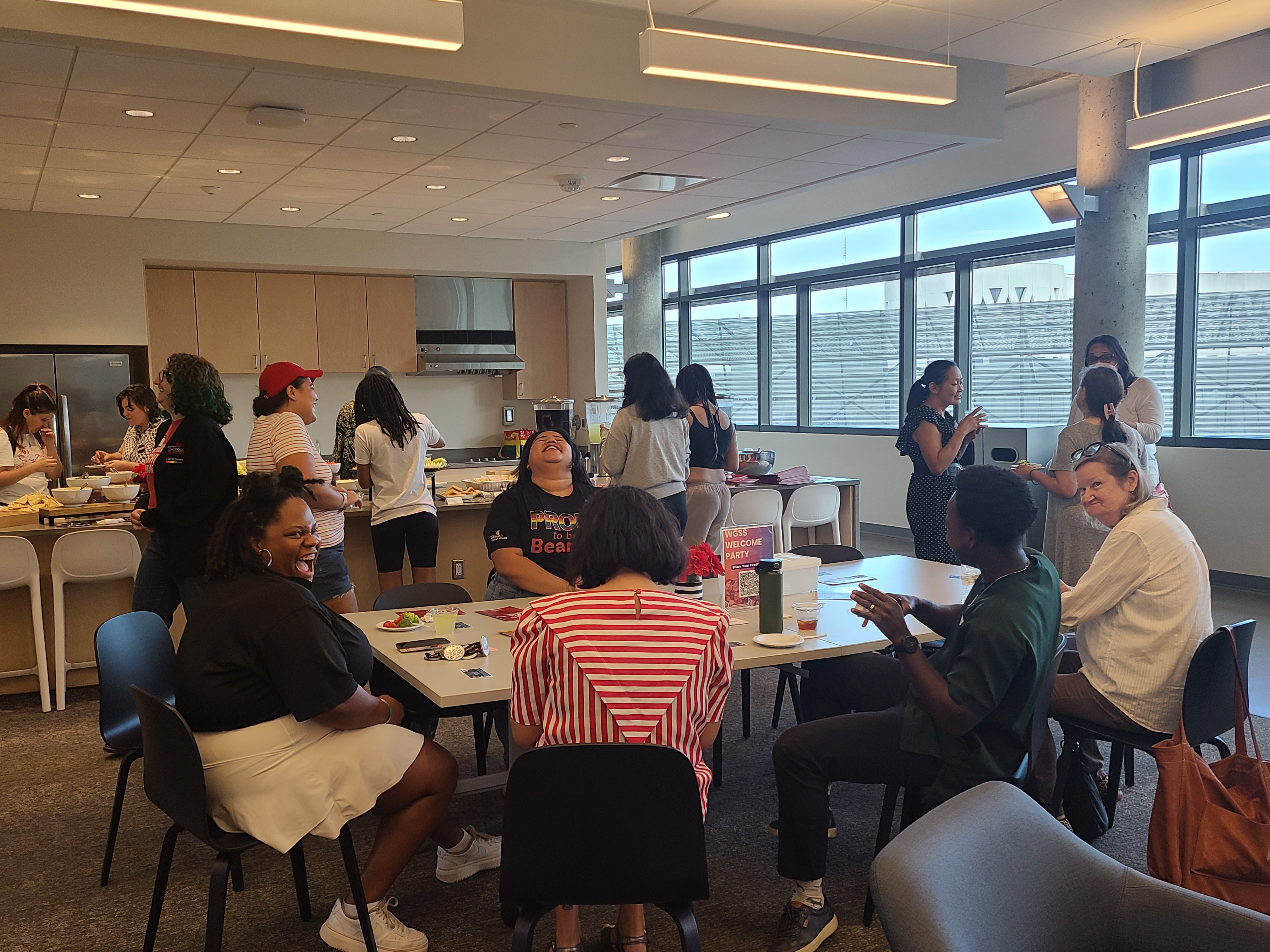 Students and Faculty sitting and talking at Welcome Party 2024