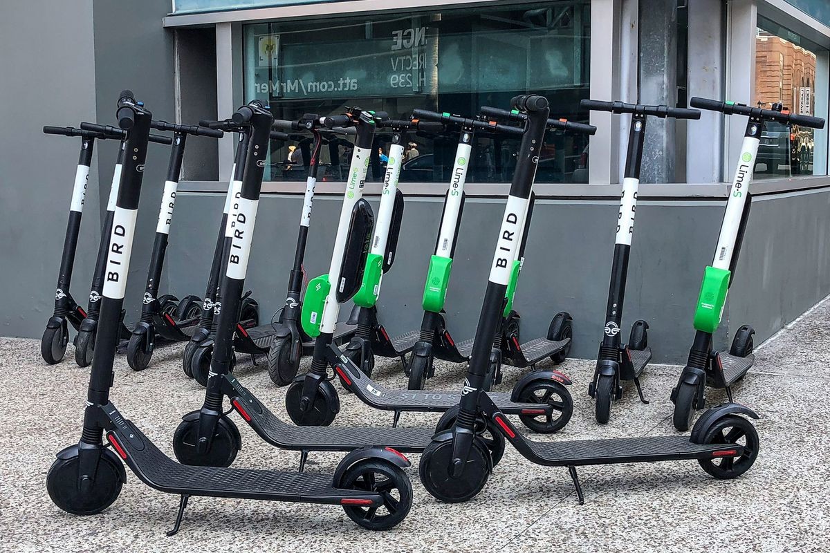 Bird and Lime Scooters crowding a street corner